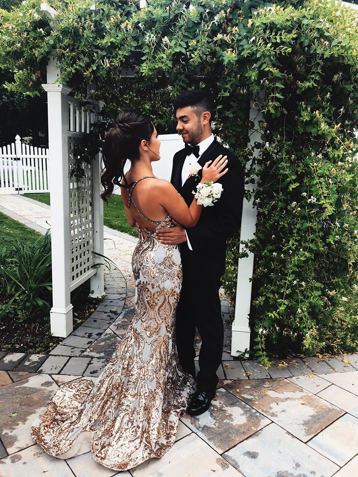 Сouple wearing a brown gown and a black suit