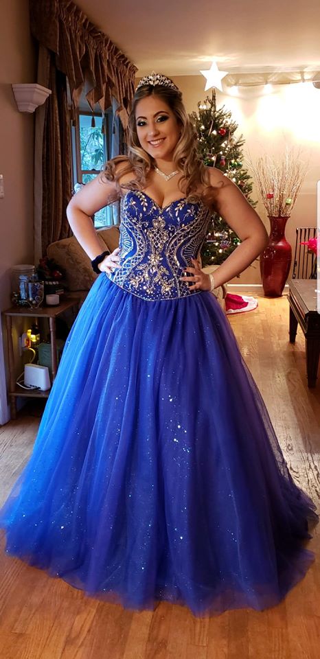 Model wearing a blue gown at home