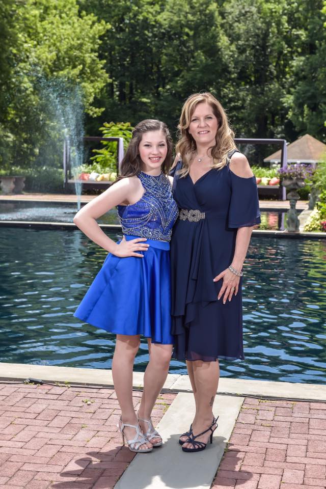 Model wearing a blue gowns near the water