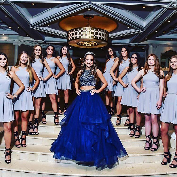 Model wearing a blue gown on the stairs