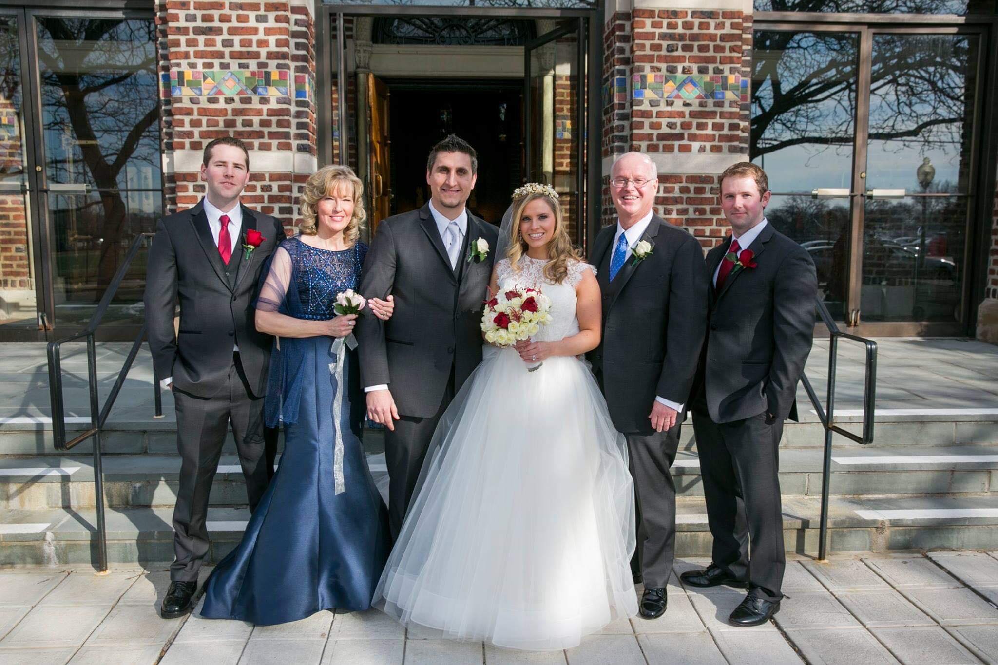 Models wearing a white gown and a gray suits