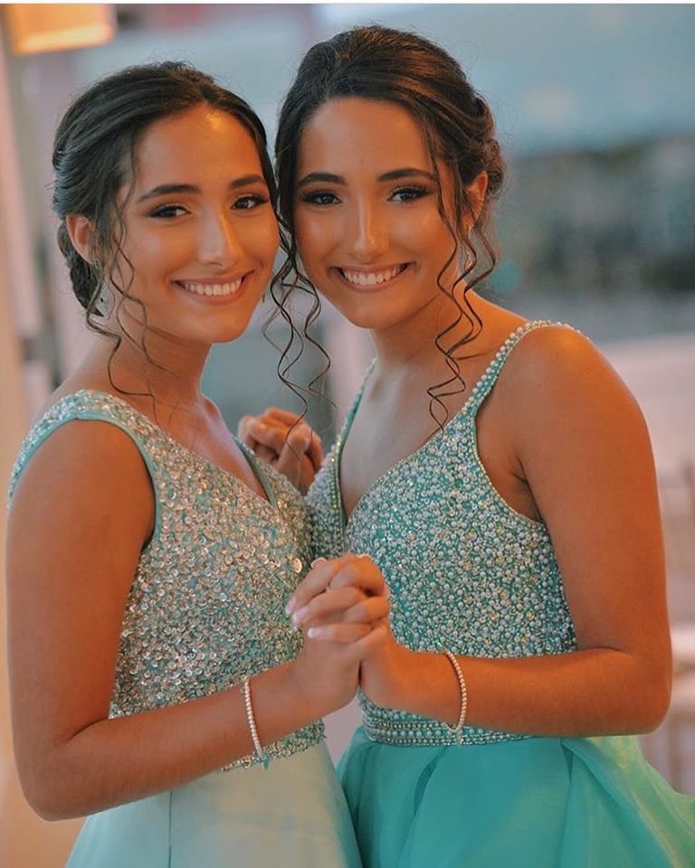 Models wearing a light green gowns